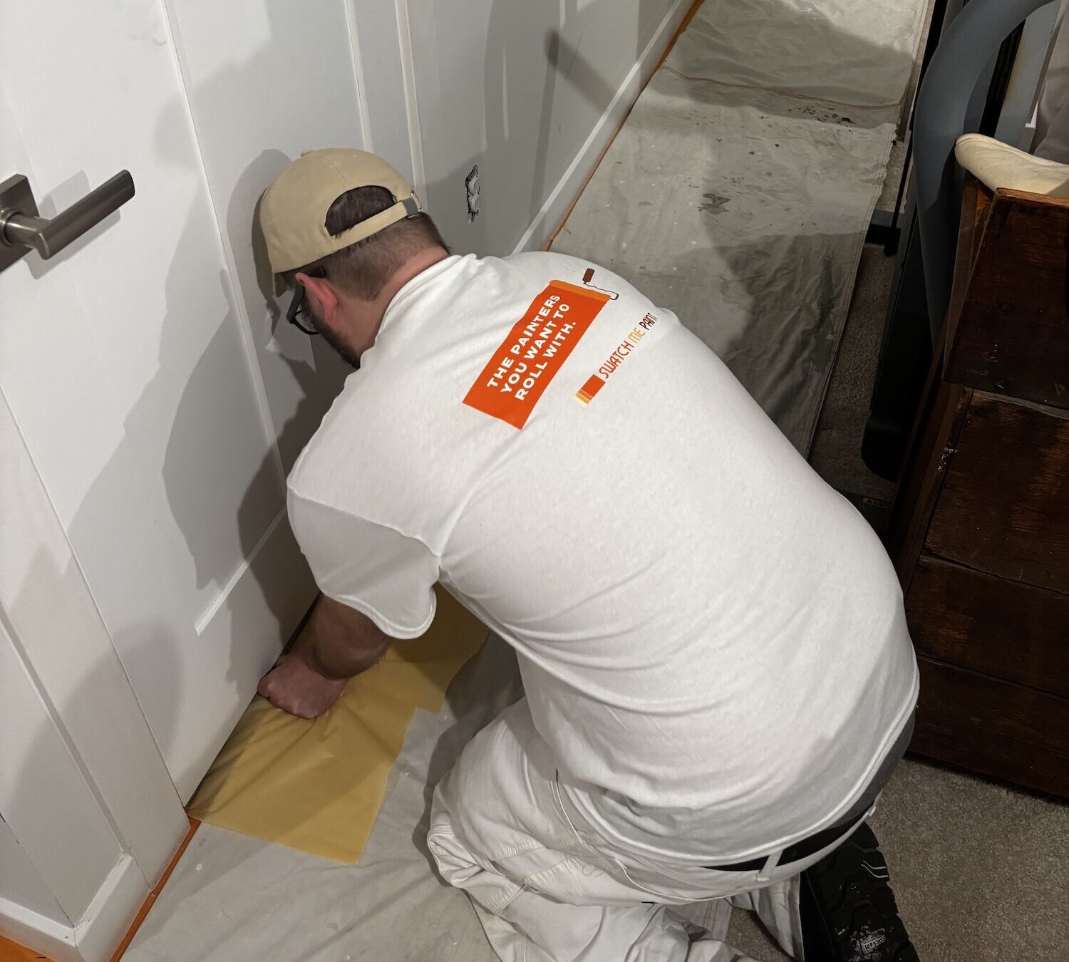 Swatch Me Paint crew preparing an interior wall for painting